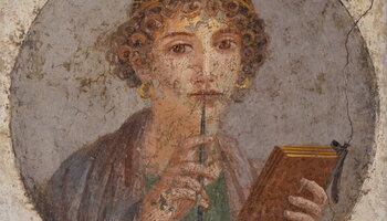Fresco of a Roman woman holding a stylus and a wax tablet