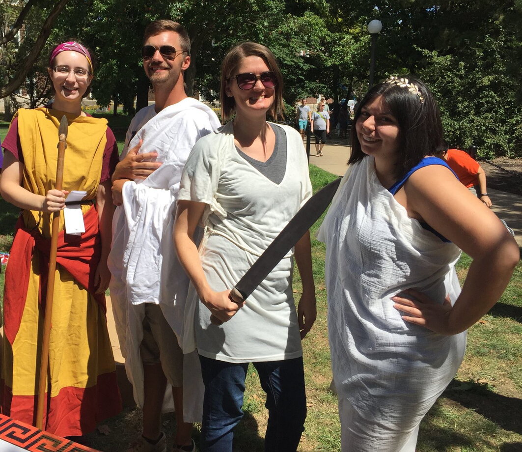 group of students dressed in classic greek attire